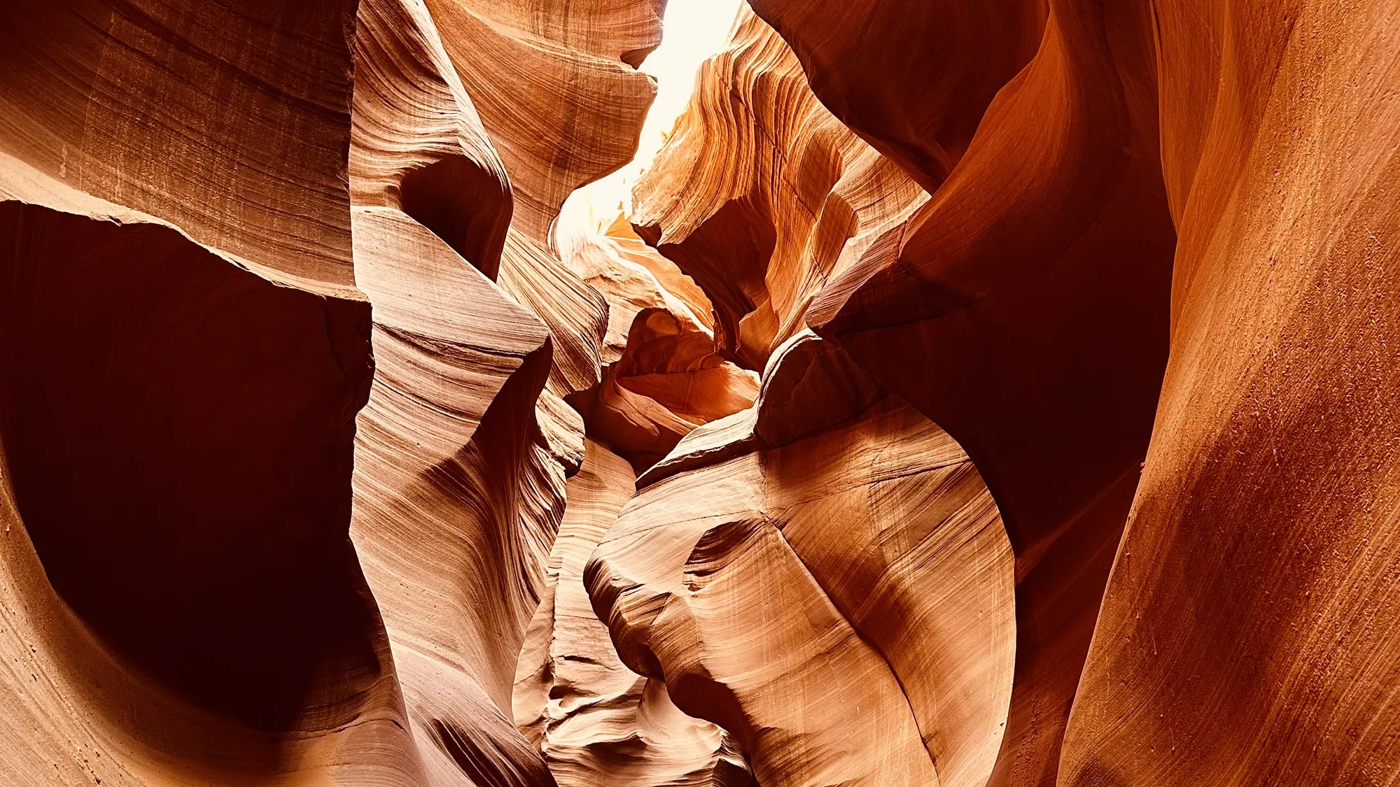 Sunlit sandstone walls inside Lower Antelope Canyon